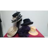 Mixed box of five occasion hats mainly decorated with feathers.