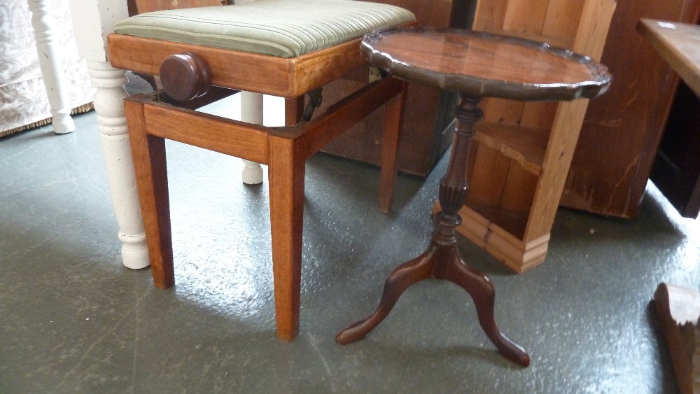 A 20th century adjustable oak music stool with green velvet seat together with an Edwardian tripod