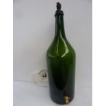 An empty 12 litre Balthazar wine bottle bearing label "Barbier Gely" with tap at base,