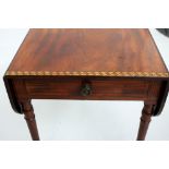 A fine Regency mahogany and sycamore Pembroke table, the rectangular top with rounded leaves,