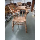 An Edwardian beech and elm captains chair