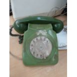 A vintage two tone green rotary dial telephone converted for modern use