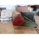 A box of mixed vintage fabrics including a large quilted piece,