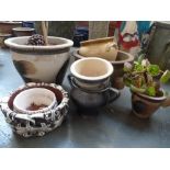 A collection of stoneware and ceramics including various pots and planters of different sizes (9)