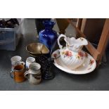 An Ironstone washbowl and jug of floral design with poppies, a large Staffordshire blue glaze vase,