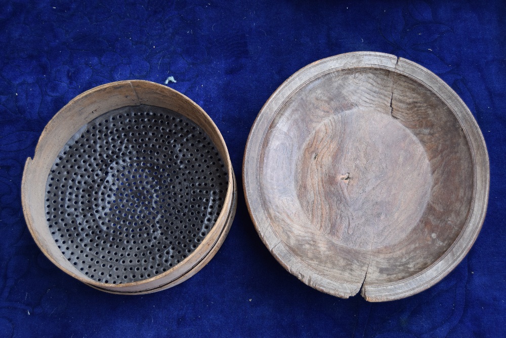 A Continental elm dairy bowl and an early 20th century petit pois grading sieve 44cmD