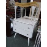 A 1950's painted white chest with two drawers and a matching dressing table and stool