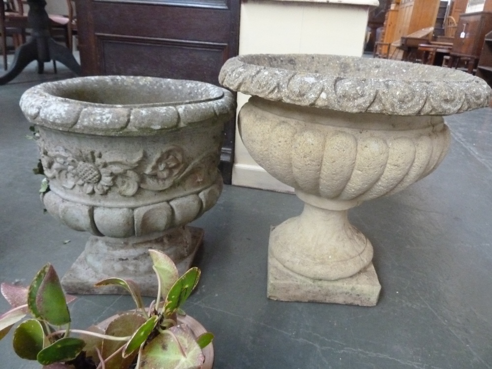 Two composite stone urns/planters in classical taste (2)