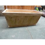 A rectangular terracotta planter decorated with ferns marked "Clarous Poterie Mane France 1867" ,