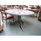 A pine and painted circular table the top painted with the Winchester round table on a baluster