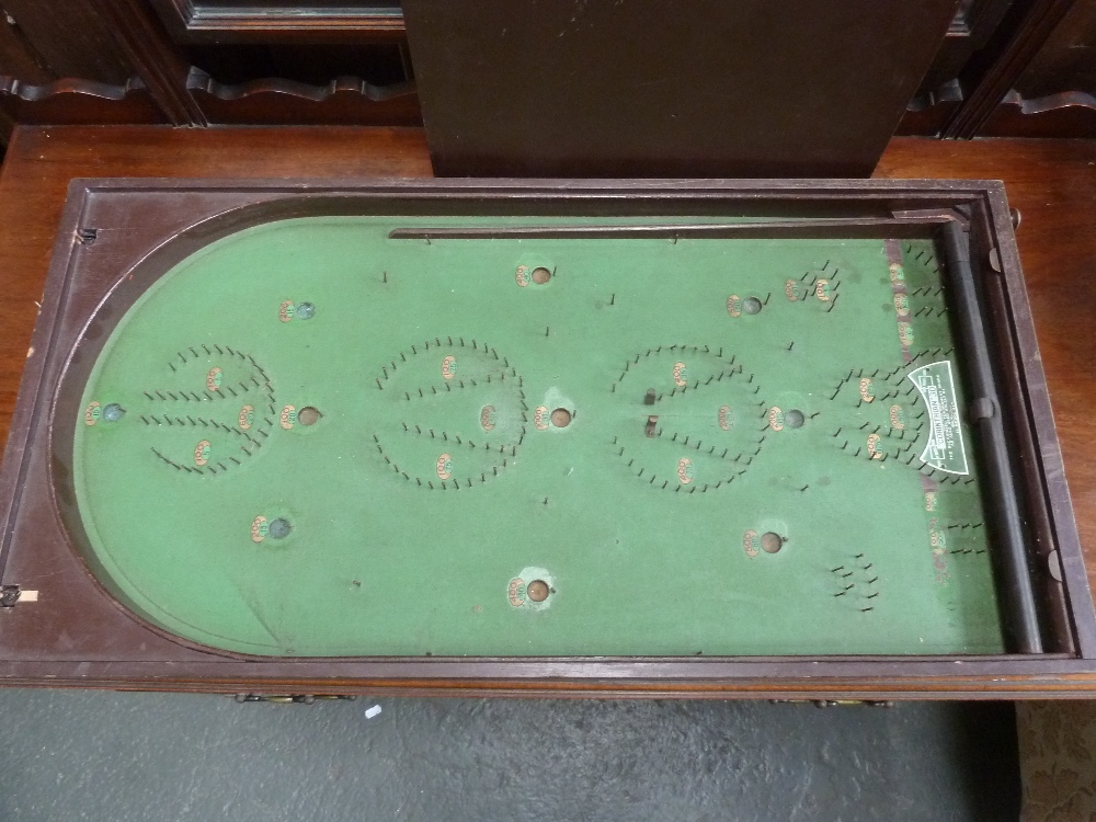 A Bagatelle board with wooden cover