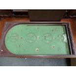 A Bagatelle board with wooden cover