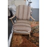 An Ercol beech framed lounge armchair with loose cushions