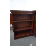 A 20th century mahogany bookshelf with banded top,