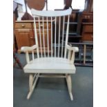 A painted white spindle back rocking chair together with a 20th century circular nursing chair,