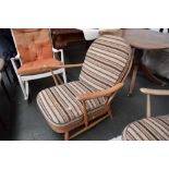 An Ercol beech framed lounge armchair with loose cushions