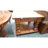 A pine square side table with four twist supports and under shelf on bun feet together with another