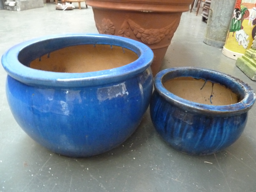 A blue glazed stoneware planter and another smaller of a similar design (2)