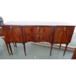 A 20th century mahogany and banded sideboard with two central drawers flanked by two cupboards with