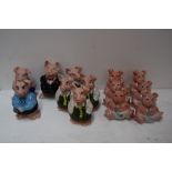 A collection of thirteen Wade Nat West pig money banks including six babies,