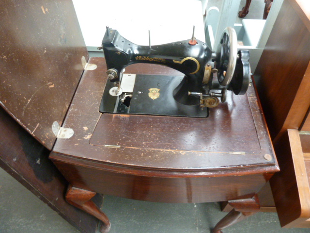 A sewing machine table, in mahogany case,