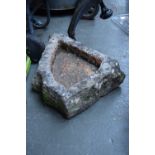 A stone bird bath 50cm long