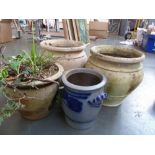 Three stoneware planters together with a German style salt glazed pot