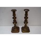 A pair of 19th century brass candlesticks,