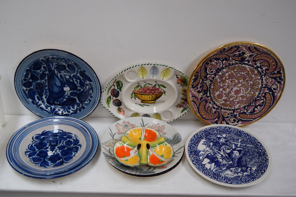 A quantity of ceramics including large decorative plates and platters,