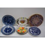 A quantity of ceramics including large decorative plates and platters,