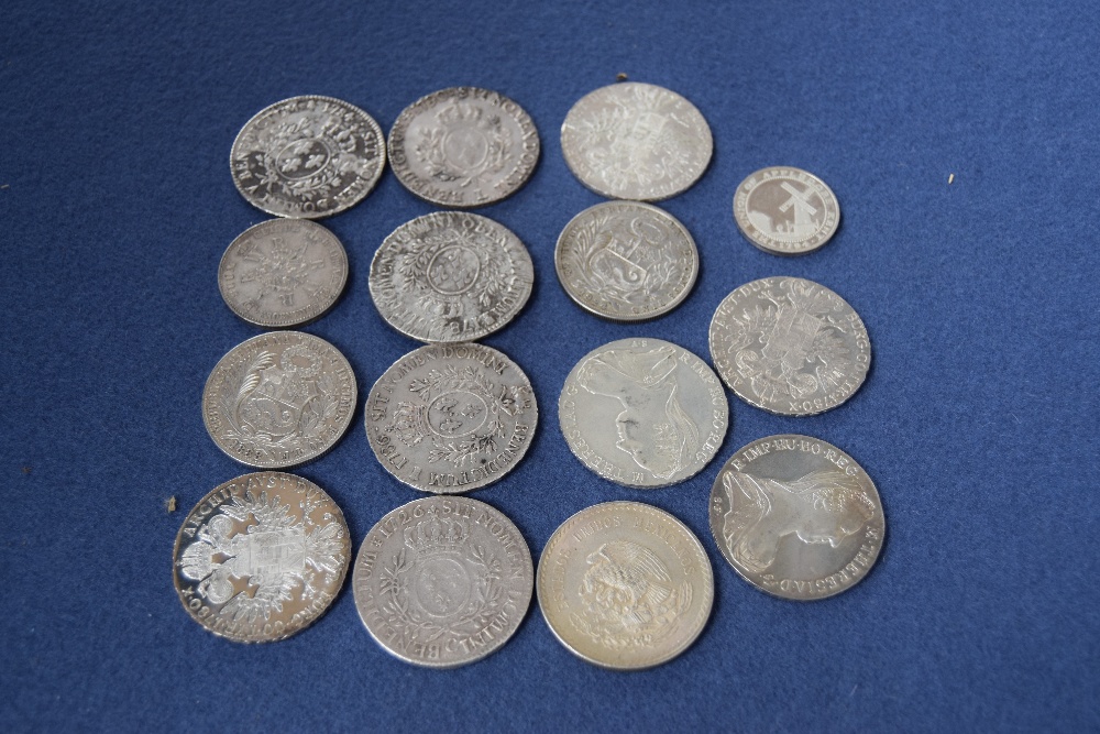 A selection of 18th century French Ecu, some Maria Theresa Thalers, with other silver coins,