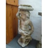 A composite stone pot stand in the form of a cherub with an eagle at its feet 80cmH