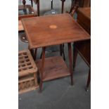 An Edwardian mahogany satinwood centre table with undershelf