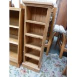 A narrow pine four shelf bookcase,