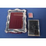 An Art Deco silver picture frame, by Deykin & Harrison, Birmingham 1925, with one smaller,