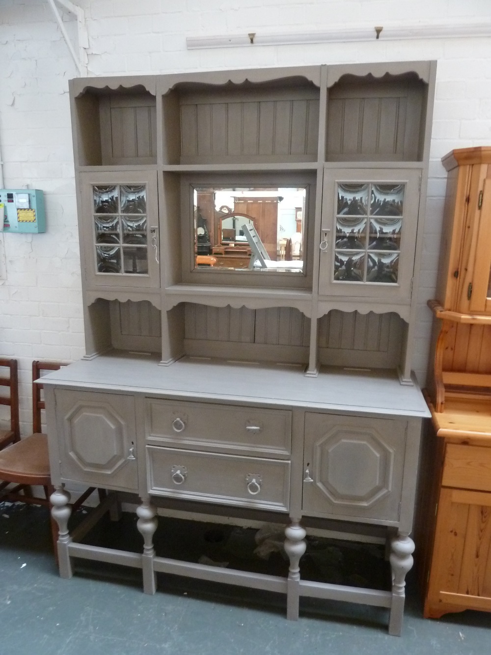 A painted pine dresser carved cornice with central mirror,