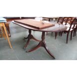 A 20th century mahogany extending dining table,