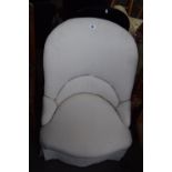 A Victorian style upholstered ladies chair in white cotton