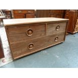 A 20th century teak chest, two short drawers over one long drawer,