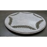 A round marble table top with fern relief and painted pine with gilt metal border below 90cm D