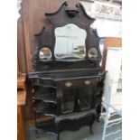 A continental ebonised dressing table broken pediment over three mirrors with central drawer and