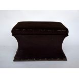 A mid Victorian rosewood framed ottoman stool of concave rectangular form on lappet carved bun feet,