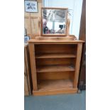 A pine bookshelf with two shelves and a top rail together with a pine toilet mirror