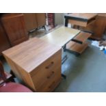 A group of office furniture including a mobile table,
