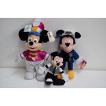 Three Disney Plush Mickey Mouse toys of various sizes