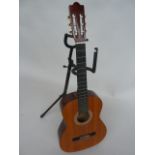 A Hohner five string acoustic guitar model MC-05 and stand