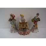 Three Italian Pottery figurine posy vases in the from of a lady playing a piano,