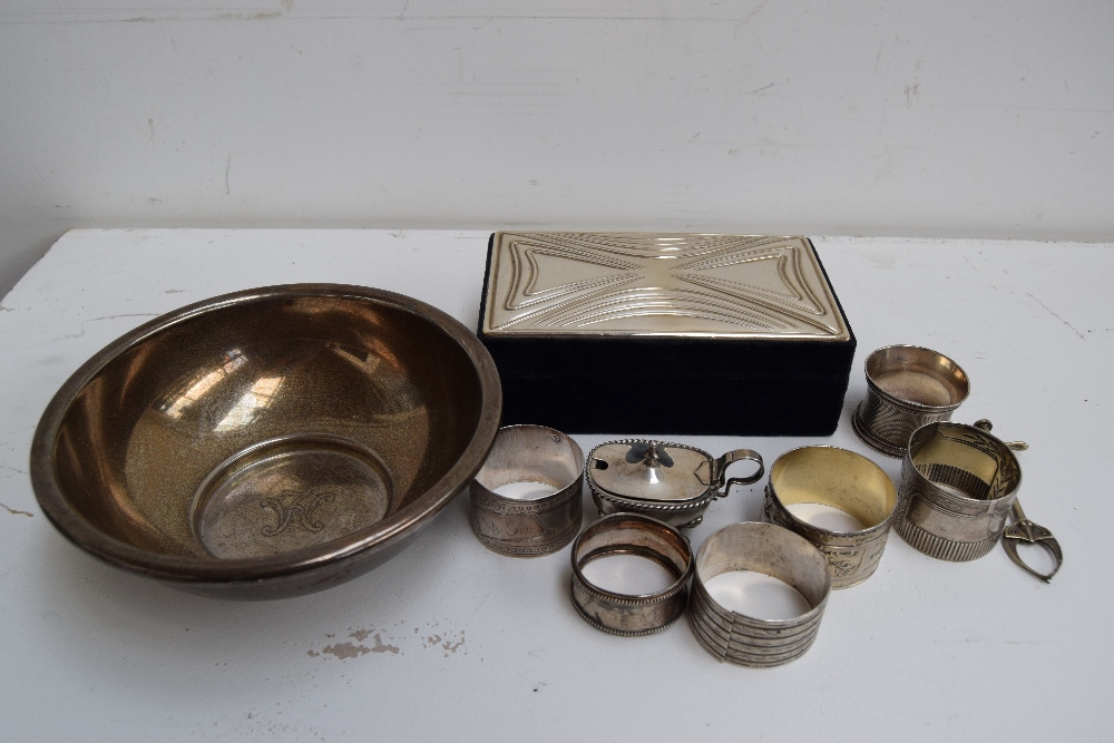 A silver mounted card box, mustard pot, six napkin rings,