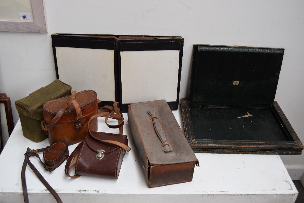 A wartime canvas binocular case, leather compass case,