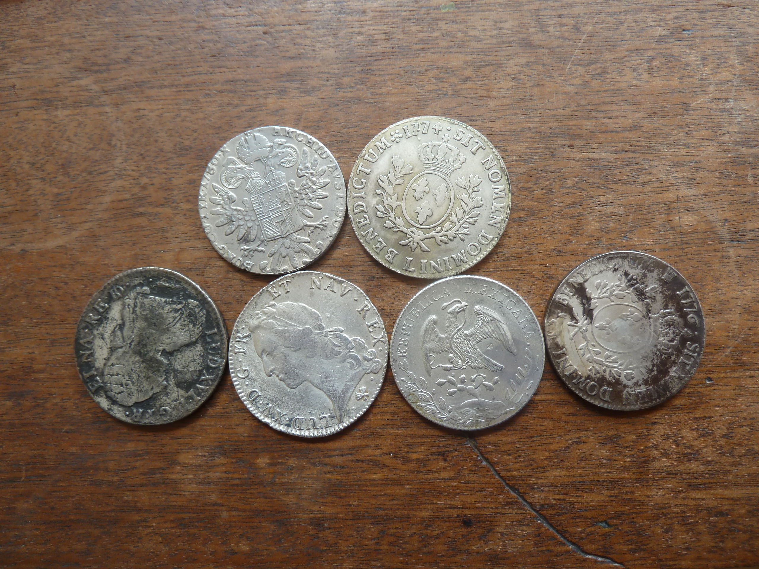 A selection of six imitation silver coins, including Ecus, Thalers,